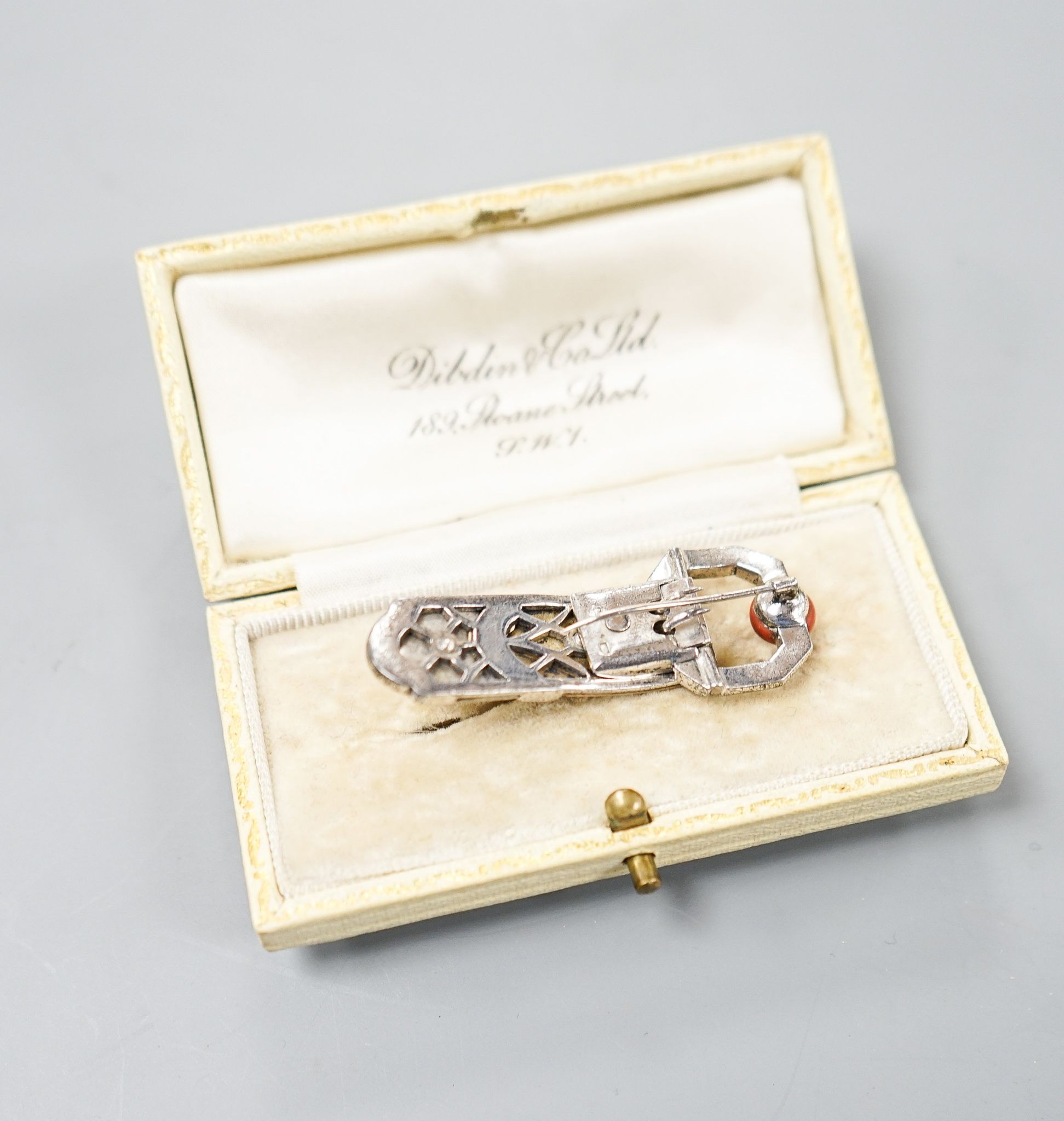 A German Art Deco 935 white metal, carnelian and white paste set clip brooch, 45mm, in Dibdin & Co leather box.